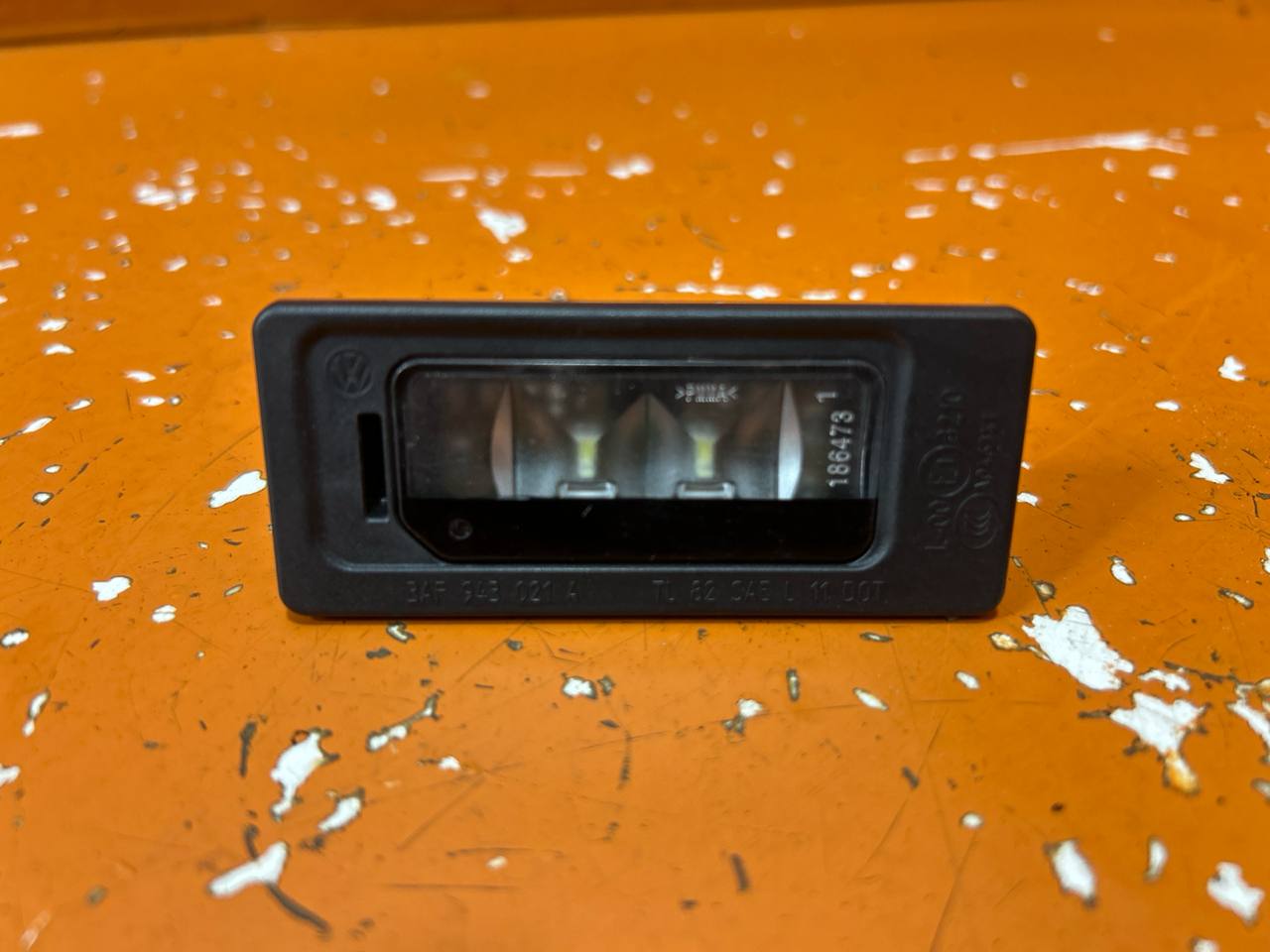 Volkswagen Passat B7 (2010—2015) Подсветка номера 3AF943021A 01020505
