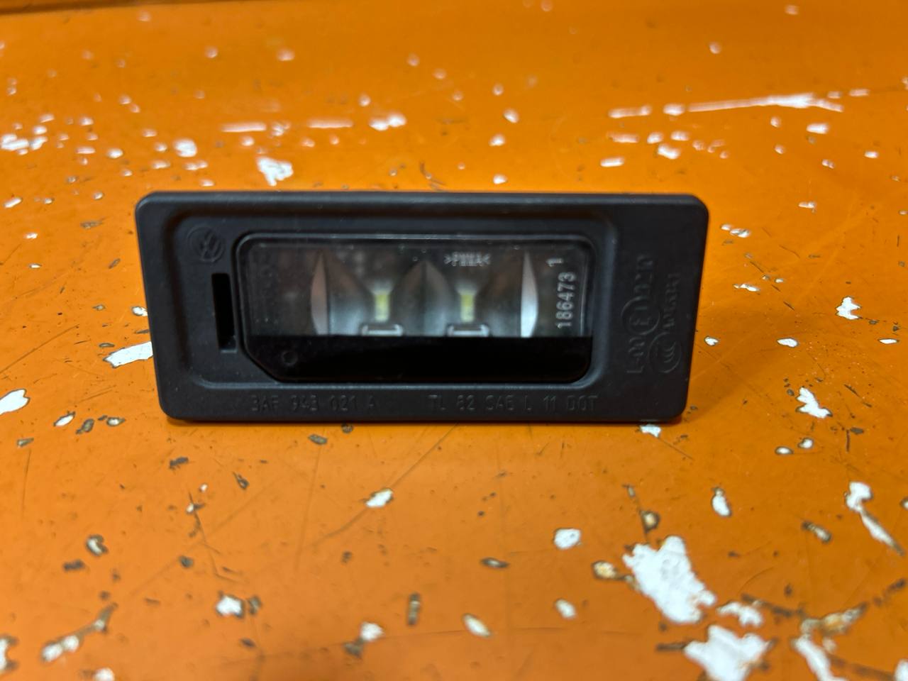 Volkswagen Passat B7 (2010—2015) Подсветка номера 3AF943021A 01020547